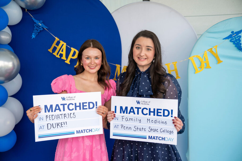Alison Marcum and Amber Schifano hold I Matched signs for Duke and Penn State.