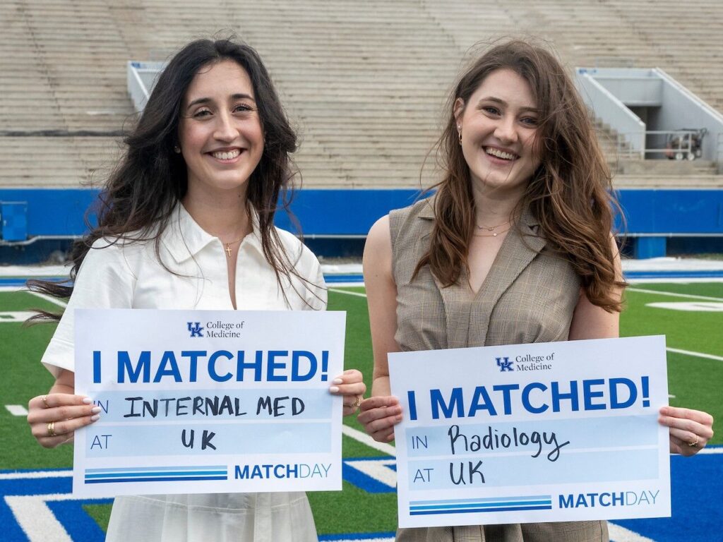 Callie Whitus and Kylie Cochran hold I Matched signs for Internal Medicine and Radiology at UK.