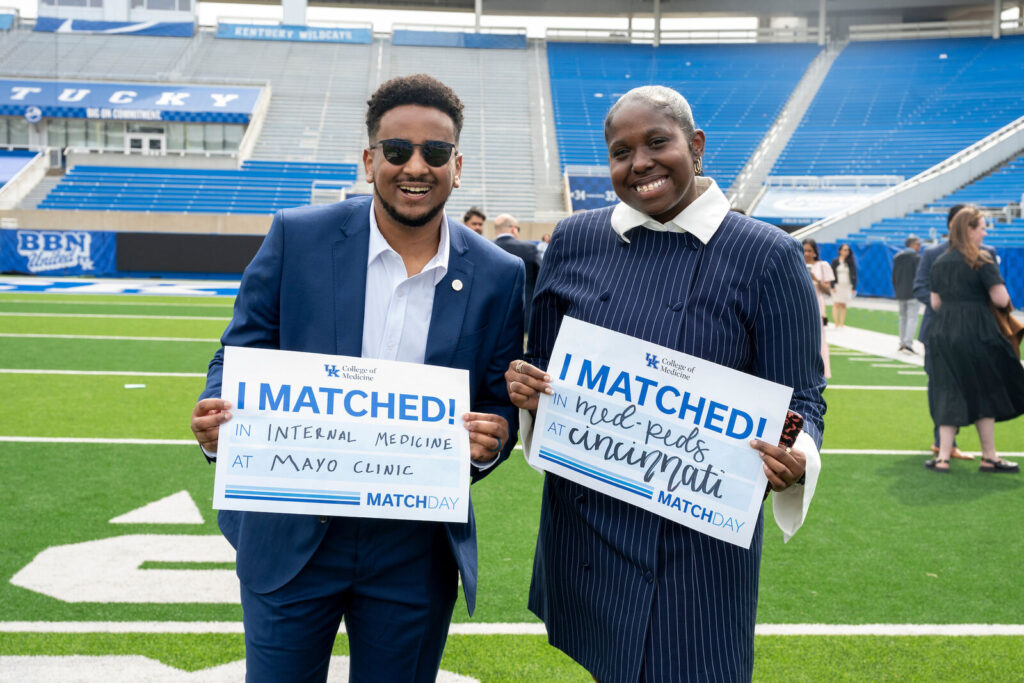 Kidus Shiferawe and DeAsia King hold I Matched signs for Mayo Clinic and Cincinnati.