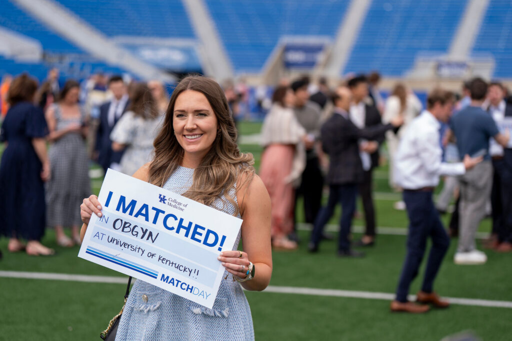 Olivia Elbert holds an I Matched sign for OBGYN at University of Kentucky.