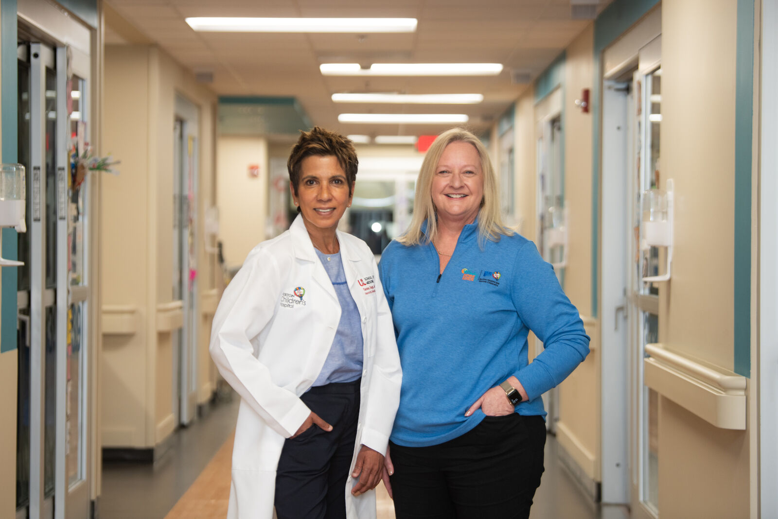 Tamina Singh, MD, and Kristine Lain, MD, in the hallway at Norton Children's Hospital