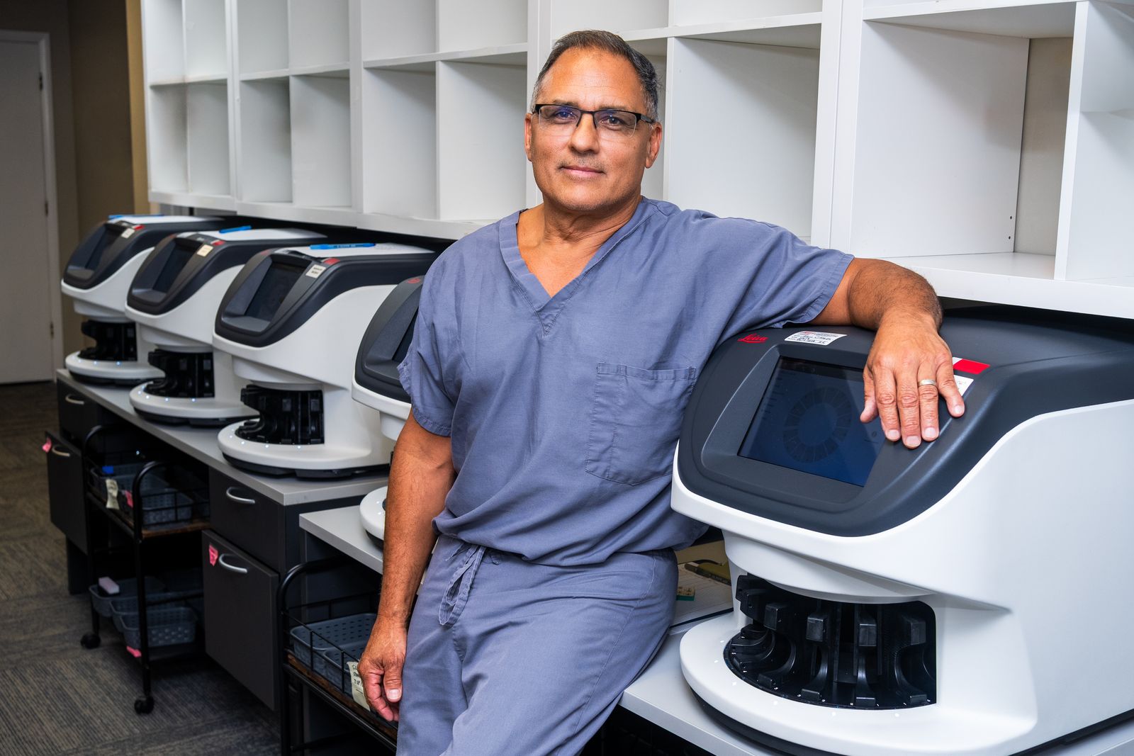 Rick Lozano leaning on a slide scanner