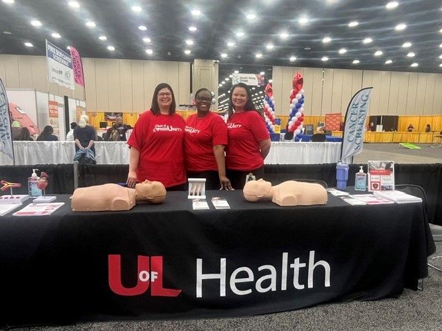 Mandi Pyles, Yette Taylor, and Stacy Girtley at the Hands Only CPR table