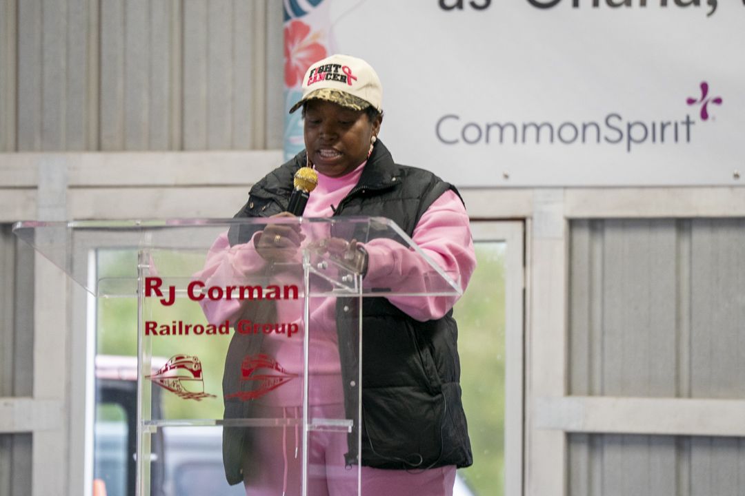Angel Brooks speaking at a podium