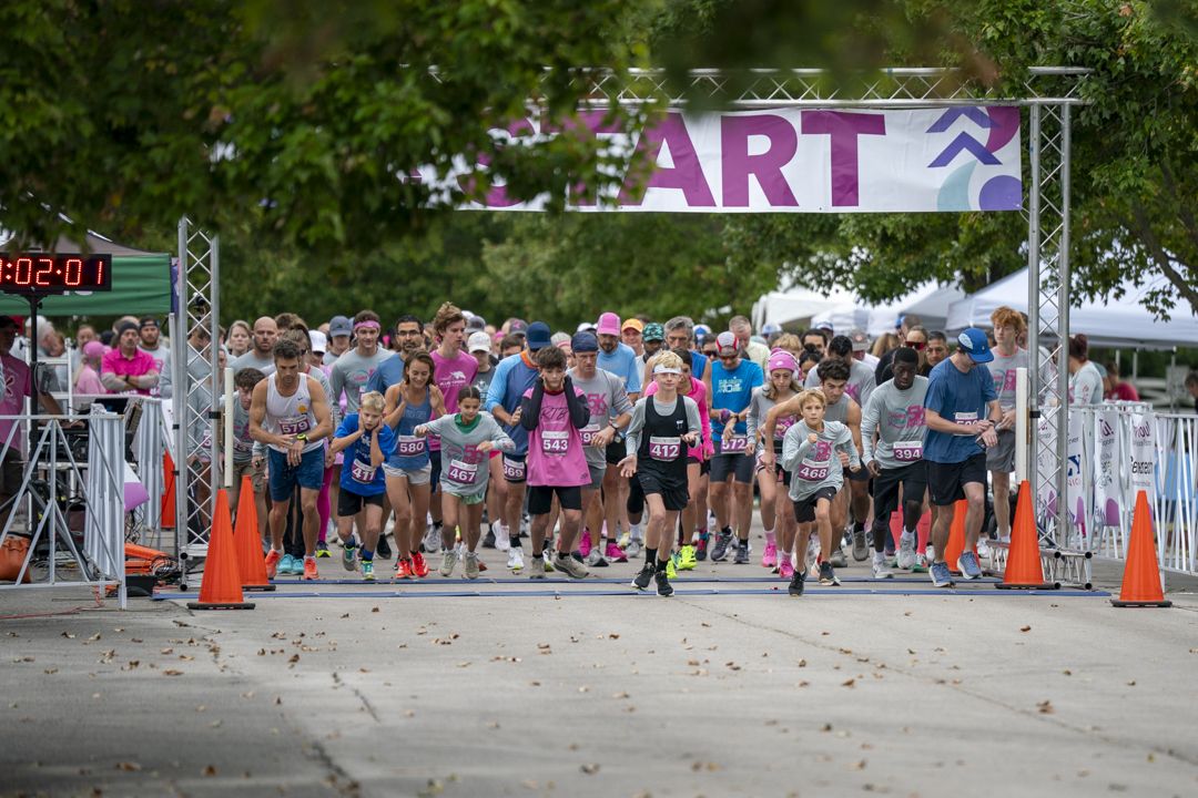Runners crossing the start line