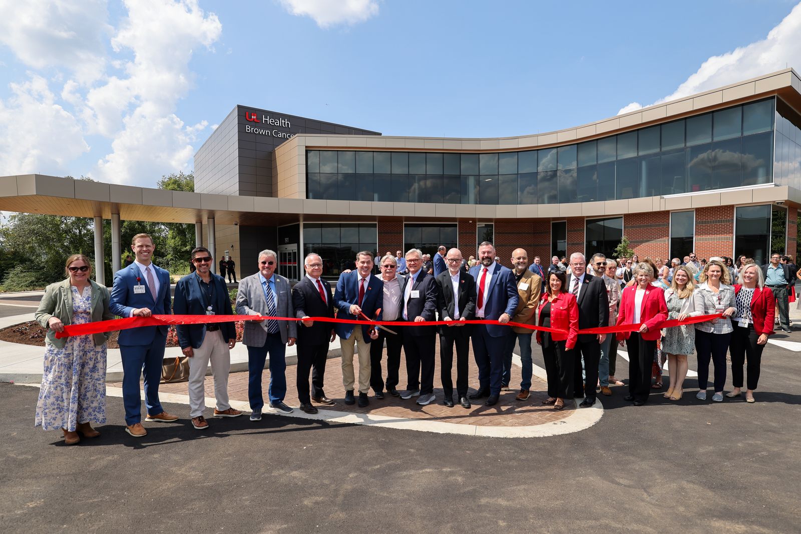 Ribbon cutting in front of the new Brown Cancer Center at South Hospital