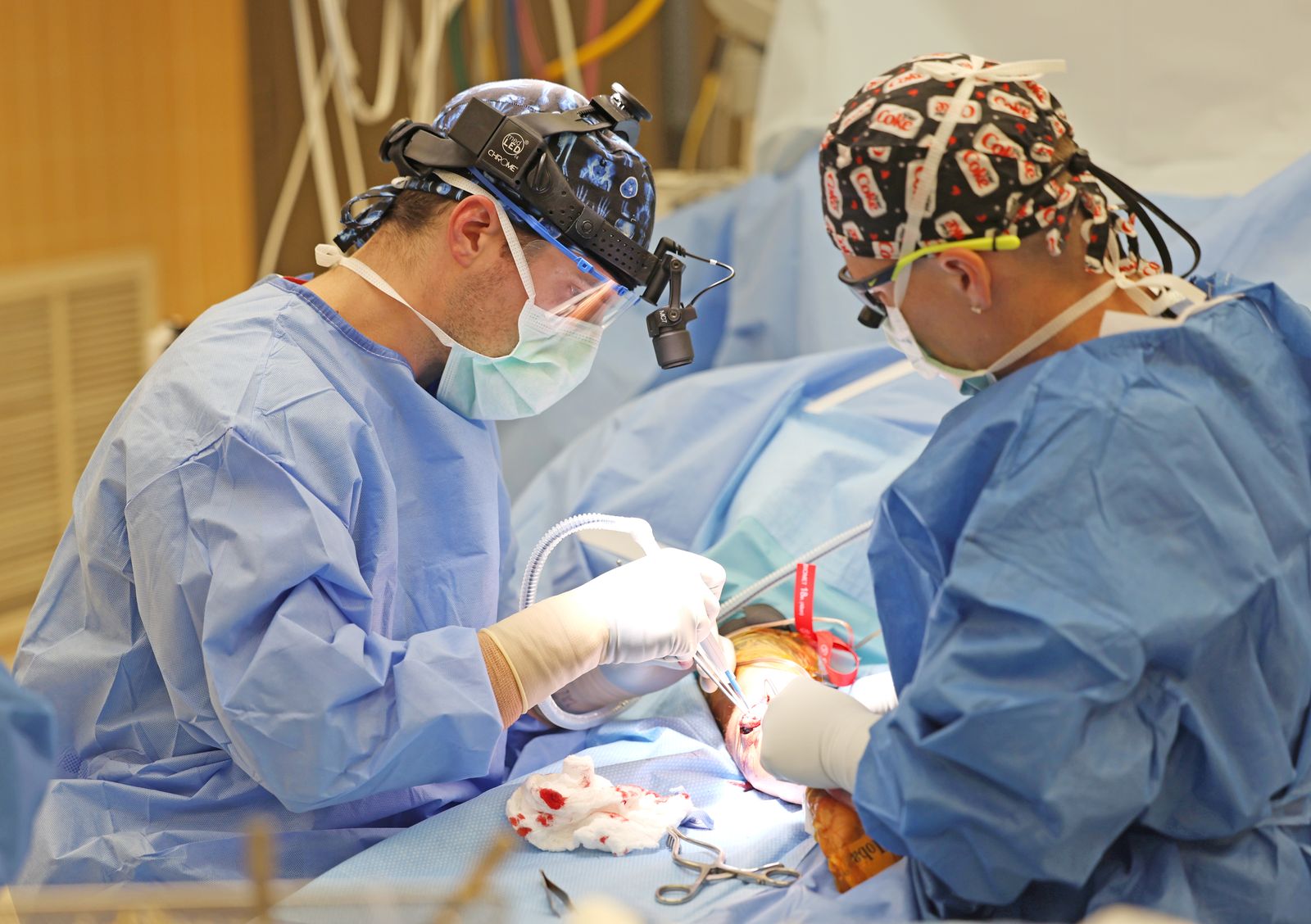 Dr. Harman and a colleague operating